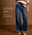 Model on brown textured background wearing blue jeans featuring BambuSoft collection.