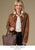Modeling showcasing fall neutrals collection. Brown jacket with white top and black jeans.