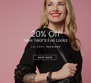 Woman holding a handbag with promotional text for 20% off New Year's Eve looks on a pink background. Use code: DAZZLE20. 