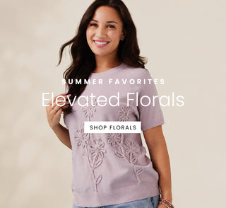 Woman wearing a light purple dress with floral embroidery on a beige background, promoting 'Elevated Florals' with text overlay.