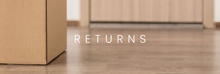 Cardboard box on a wooden floor with ' RETURNS' text overlay
