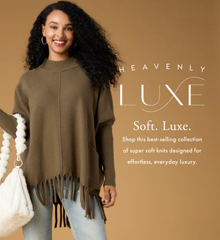 Model wearing olive sweater with fringe on a tan background with copy 'HEAVENLY LUXE' collection