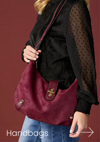 Model showing a maroon crossbody bag with black shirt on a red background with copy 'HANDBAGS'