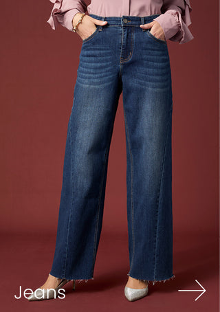 Model wearing dark denim jeans on a maroon background with copy 'JEANS'