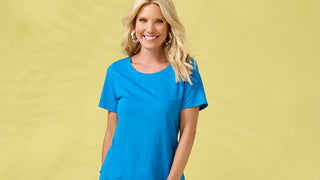 Woman wearing a blue t-shirt against a yellow background