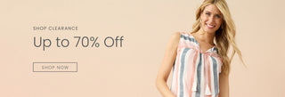 Woman wearing colorful striped tank top on neutral background