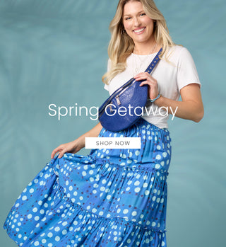 Woman in a blue polka dot dress holding a blue bag with 'Spring Getaway' text on a teal background.