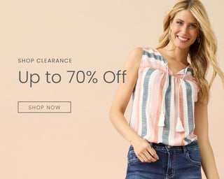 Woman wearing colorful striped tank top on neutral background